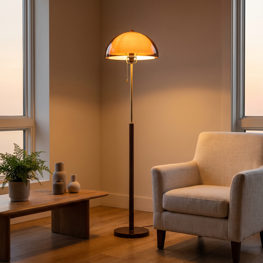 Amber Dome Floor Lamp, switched on in a cozy interior at dusk