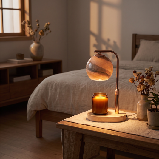 Glass Sphere Candle Warmer Lamp, switched on in a cozy interior at dusk