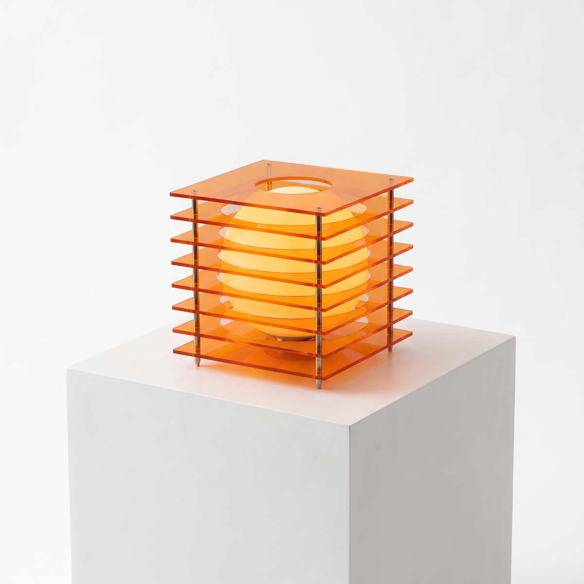 Acrylic Cube Sphere Night Light in Sunset Orange on a white display plinth