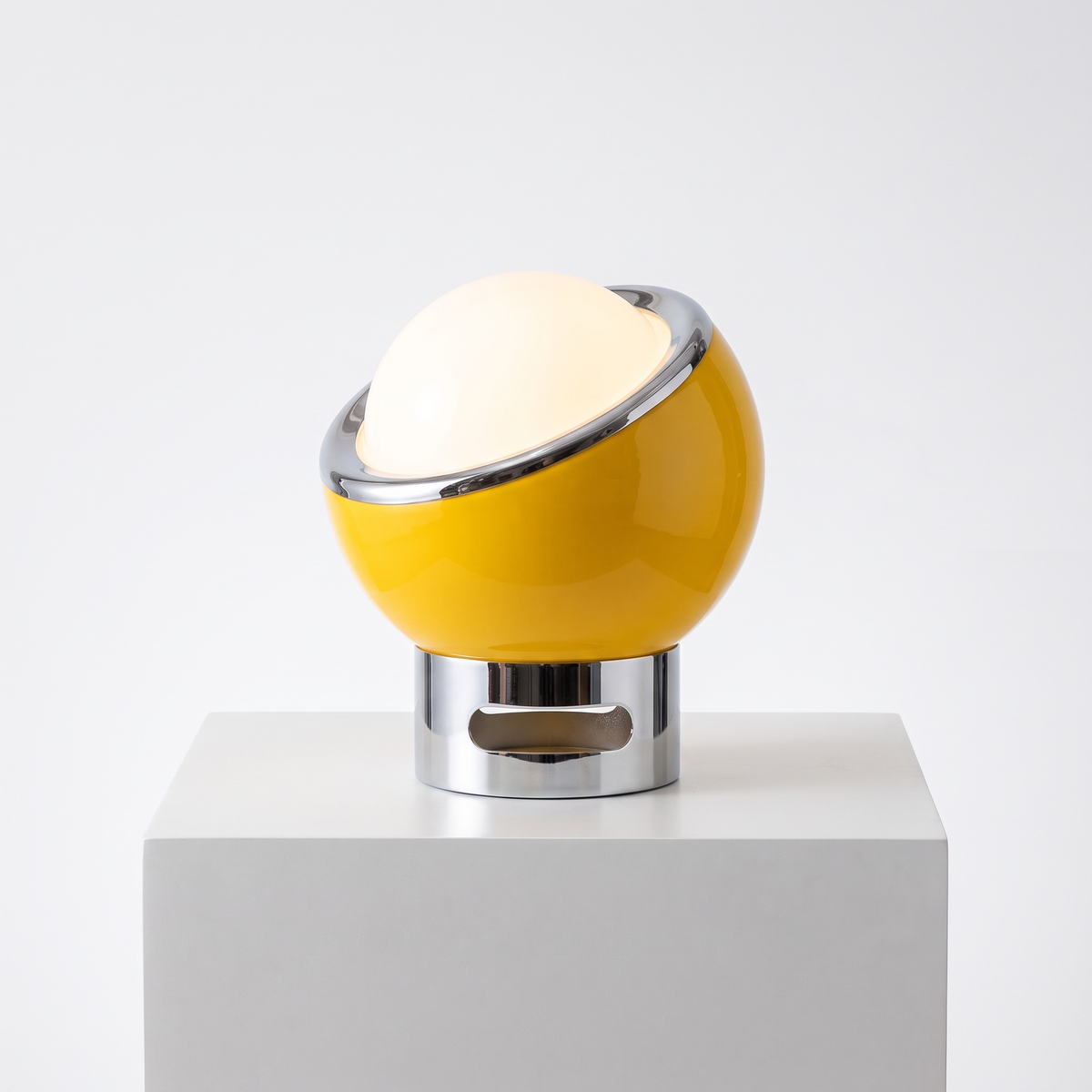 Space Age Egg Table Lamp in Yellow on a white display plinth