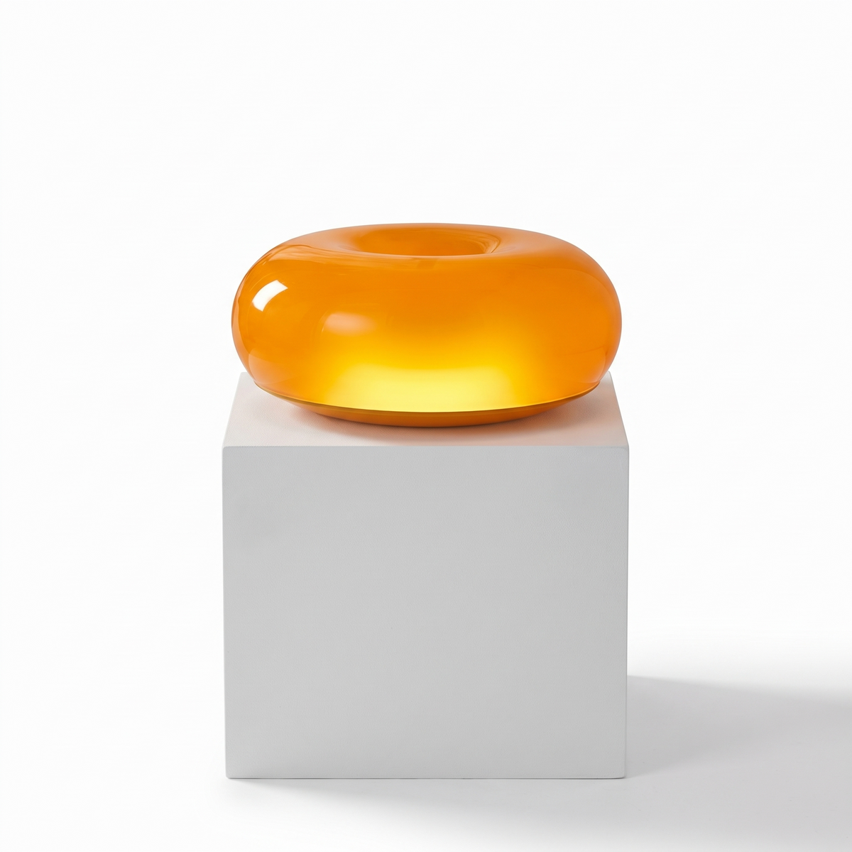 Bauhaus Donut Table Lamp on a white display plinth, full view