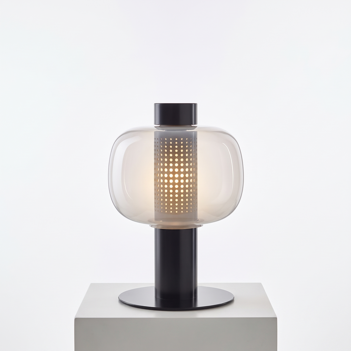 Mid-Century Bedside Table Lamp in Type B, clear glass with black base on a white display plinth