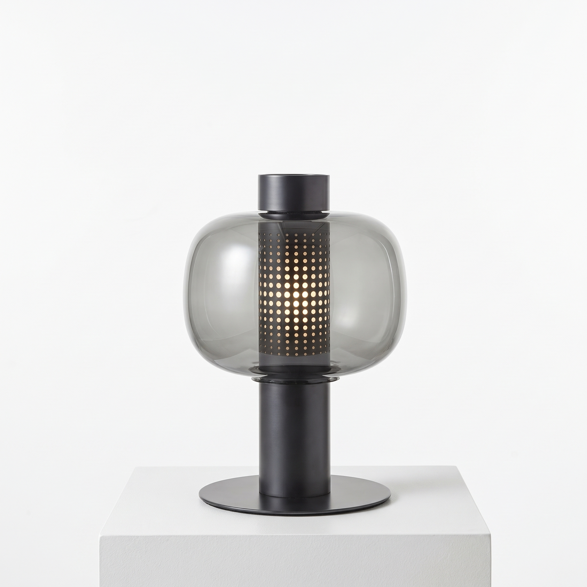 Mid-Century Bedside Table Lamp in Type C, smoke glass with black base on a white display plinth