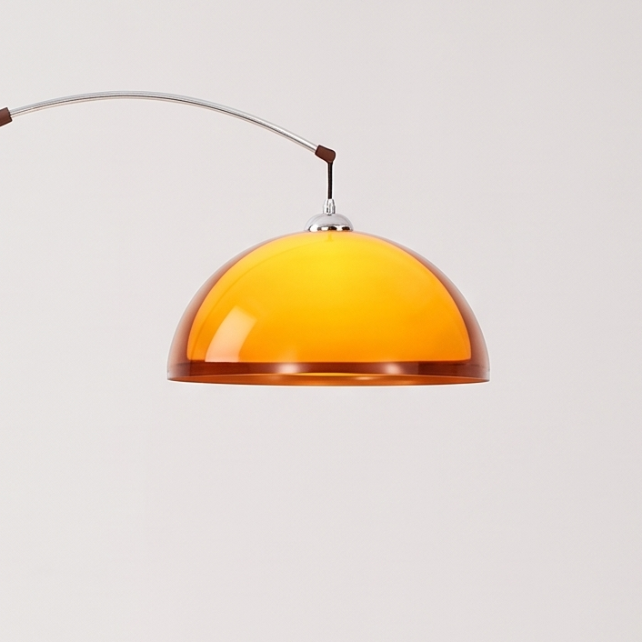 Mid-Century Arc Floor Lamp with Amber Dome on a white display plinth, close up detail