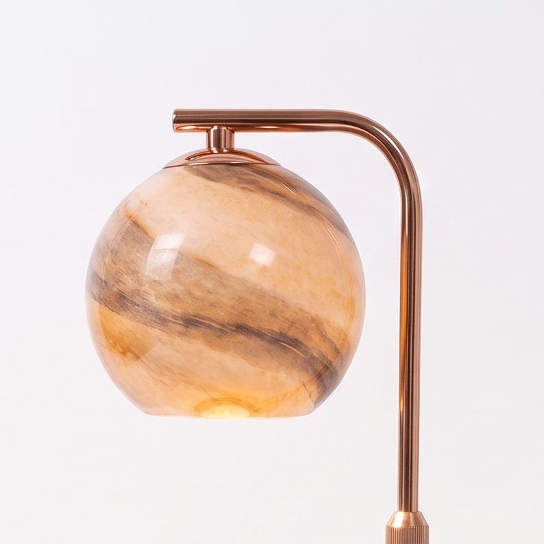 Glass Sphere Candle Warmer Lamp on a white display plinth, close up detail