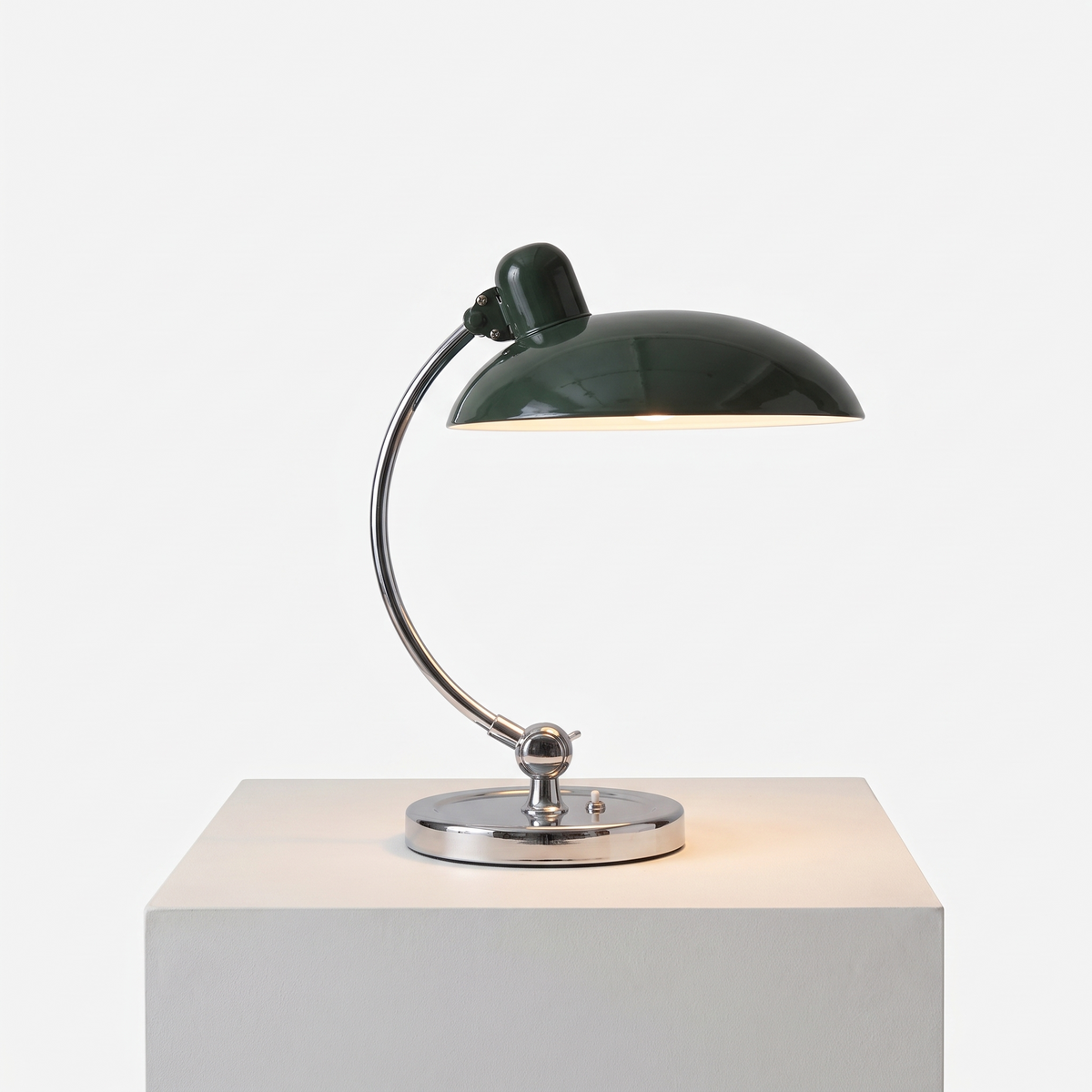 Bauhaus Mushroom Desk Lamp in Army Green on a white display plinth